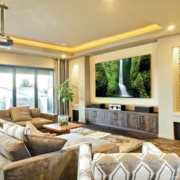 a living room with a projector, lighting, and audio system